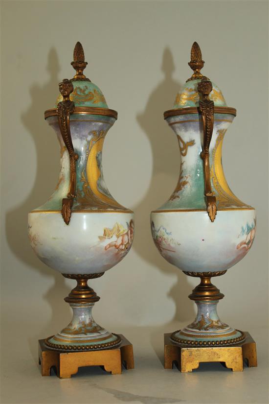 A pair of Sevres style porcelain and ormolu mounted vases and covers, late 19th / early 20th century, 31cm, one cover chipped